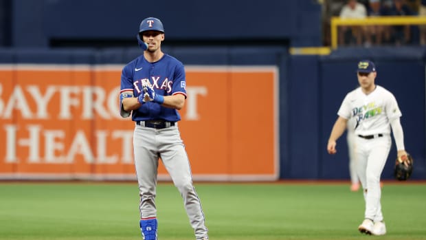 Texas Rangers left fielder Evan Carter reacts after his double against the Tampa Bay Rays in the fourth inning during Game 1 of the Wild Card series at Tropicana Field Tuesday.